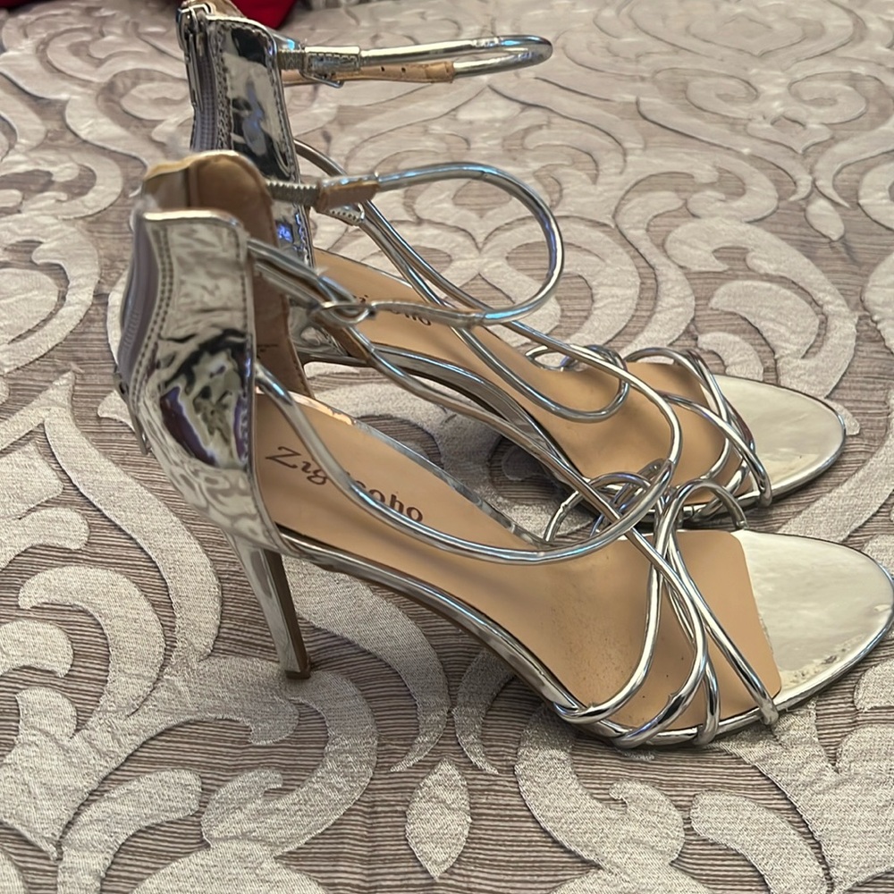Beautiful silver straps dress shoes never worn, only to try on.